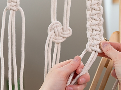 Different macrame knots. Woman making macrame at home. Stay at home hobbies.