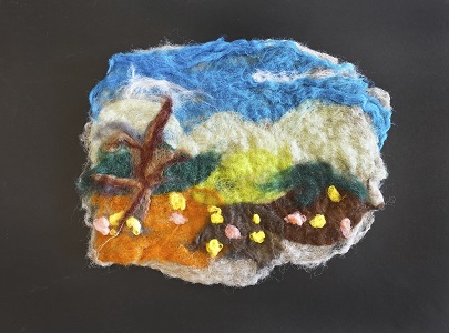 Artistic landscape made of various colors of felt.