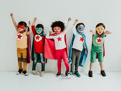 Group of Diverse Children Playing superhero on the white wall background. Superhero concept. Happy Time.