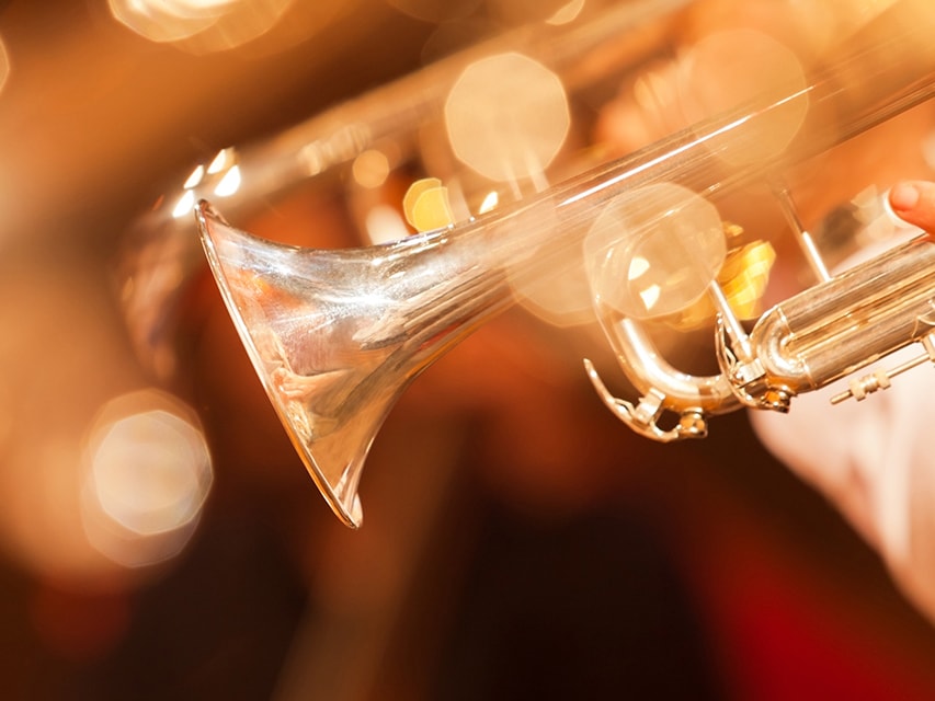 Detail of the trumpet closeup in golden tones