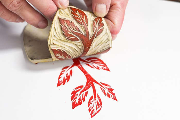 Close-up Of A Mature Woman Making A Hand-carved Linocut Print