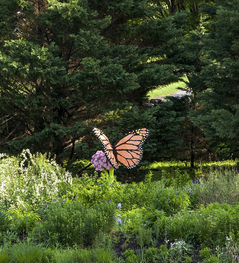 Butterfly made of LEGO in a spring garden